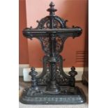 A Victorian Black Patinated Cast Iron Stick Stand By Carron Works Falkirk, with rail above