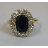 A Large Ladies Sapphire & Diamond 18ct Gold Dress Ring, the centre sapphire set with 14 brilliant