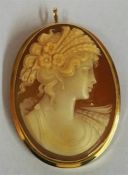 An 18ct Gold Mounted Cameo Brooch, modelled as a young lady in period dress,