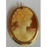 An 18ct Gold Mounted Cameo Brooch, modelled as a young lady in period dress,