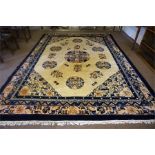 A Large Chinese Carpet, Decorated with floral panels and geometric motifs, on a cream ground with