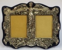 A Sterling Silver Double Photo Frame, Decorated with a moulded classical winged female flanked by