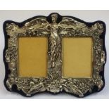A Sterling Silver Double Photo Frame, Decorated with a moulded classical winged female flanked by