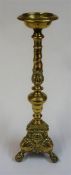 A Victorian Brass Pugin Style Candle Stand, with moulded mask decoration, raised on ball and claw