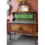 A Late Victorian Glasgow Style Walnut Wash Stand, with mirrored top above Art Nouveau turquoise