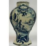 An 18th Century Delft Pottery Vase, of octagonal baluster form, in typical colours, decorated with a
