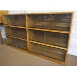 A Vintage Stacking Bookcase By Simplex, having six sections, each section with glazed sliding doors,