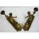 A Pair Of Antique Gilt Metal Wall Mounting Gas Lights, Modelled as a putti child holding aloft