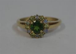 A Ladies Emerald & Gemstone 9ct Gold Cluster Ring, ring size R