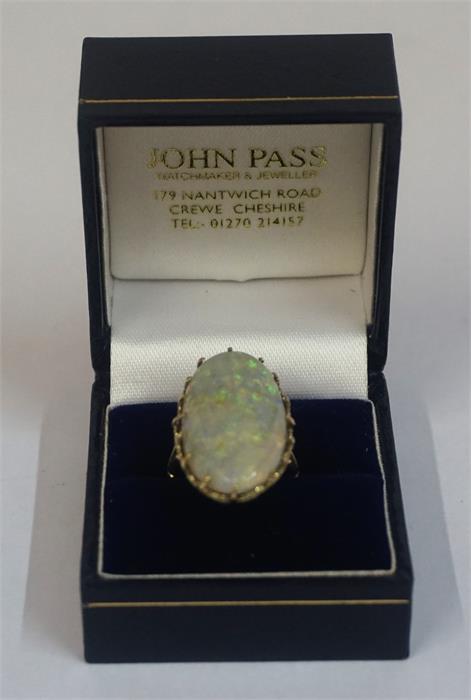 A Large Single Stone Fire Opal Ring, set with an oval opal, 3 x 1.5cm, in a claw setting, on a 9ct - Image 2 of 2