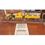 A Hornby "Rocket" Model Of A Locomotive Steam Engine, 30cm high, 85cm wide, raised on wooden plinth,