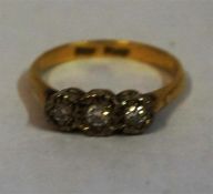 A Platinum & Diamond Three Stone Engagement Ring, set in an illusion setting, size K