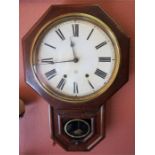 A Victorian American Mahogany Eight Day Wall Clock, in octagonal frame, with pendulum, 62cm high
