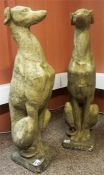 A Pair Of Composite Garden/Outside Dog Figures, in upright seated pose, raised on square plinth,
