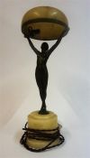 An Art Deco Bronze Figural Table Lamp, modelled as an outstretched nude female holding up the