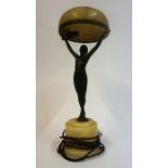 An Art Deco Bronze Figural Table Lamp, modelled as an outstretched nude female holding up the