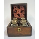 Four Antique Glass Apothecary Bottles With Stoppers, enclosed in a Georgian rosewood box,