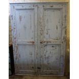 An Antique Farmhouse Painted Pine Cupboard, Painted in grey, with two panelled doors enclosing
