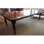 A Victorian Style Mahogany Extending Pull Out Dining Table, with two additional leaves, raised on