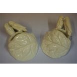A Pair Of Victorian Wall Pockets By Royal Worcester, with a surmount decorated with parrots