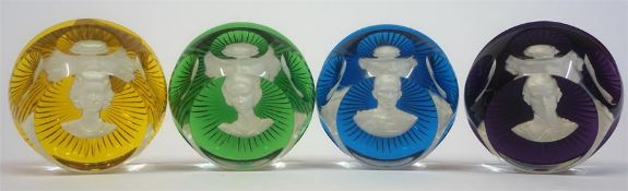 A Set Of Four French Baccarat Glass Paperweights, depicting a bust to each of a member of the