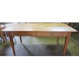 A Farmhouse Pine Table, The rectangular top with two drawers, raised on tapered legs, 75cm high,