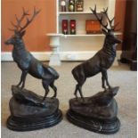 After J. Mogniez A Pair Of Bronze Royal Stag Figures, " Monarch of the Glen", standing on rocks,
