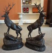 After J. Mogniez A Pair Of Bronze Royal Stag Figures, " Monarch of the Glen", standing on rocks,