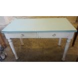 A Victorian White Painted Kitchen Table, with a formica top above two drawers, raised on turned