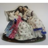 A Continental Porcelain Inkwell, circa late 19th century, in the form of three females, in two