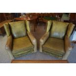 A Pair Of Green Hide Wing Armchairs, with stud decoration, 87cm high, (2)