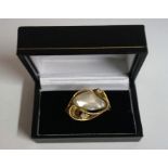 A 14k Gold Mother Of Pearl & Diamond Ring, with a large Mother of Pearl stone measuring