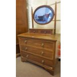 An Edwardian Mahogany Inlaid Dressing Chest, with swing mirror above two small drawers and three