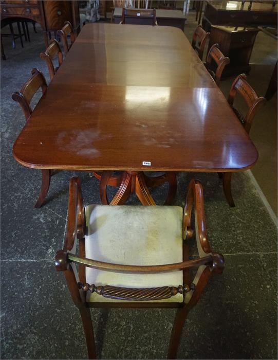 A Reproduction Mahogany Twin Pillar Dining table With Eight Dining Chairs, in the Regency style,