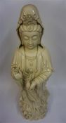 A Large Chinese Blanc De Chine Glazed Pottery Figure Of Guanyin, 20th century, wearing a robe and