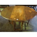 An Oak Gateleg Table, raised on barley twist legs, 70cm high, 108cm long, 77cm wide