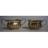 A Silver Cream Jug With Matching Sugar Bowl, Hallmarks for Birmingham 1938, 5cm high, overall weight