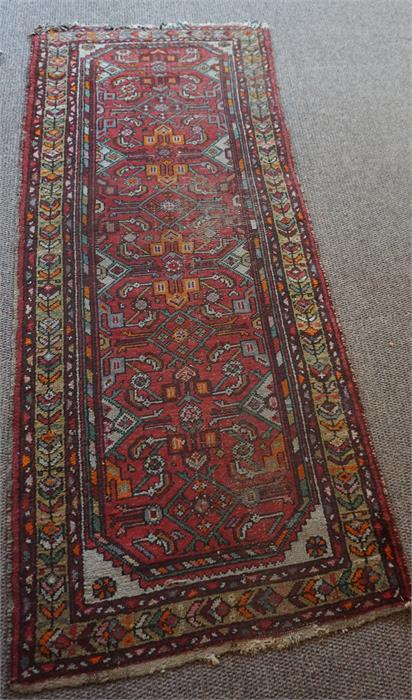 A Persian Hamadan Hand Knotted Runner, Decorated with multiple geometric and floral panels on a