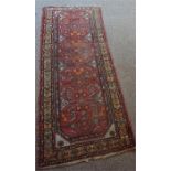 A Persian Hamadan Hand Knotted Runner, Decorated with multiple geometric and floral panels on a