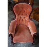 A Victorian Style Spoon Back Armchair, Upholstered in later pink button back velour, 104cm high