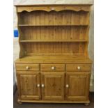 A Pine Kitchen Dresser, with open shelving above three small drawers and three cupboard doors, 178cm