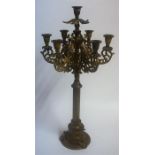 A Large Corinthian Style Painted Iron Candleabra, with six sconces, 64cm high
