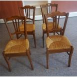 A Set Of Four Pear Wood Parlour Chairs, 20th century, with woven rush seats, 85cm high, (4)