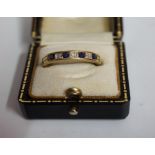 A 9ct Gold Diamond & Sapphire Seven Stone Ring, Comprising of three diamond stones and four sapphire