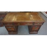 A Mahogany Kneehole Desk By Edwards & Roberts, circa early 20th century, with a tooled leather