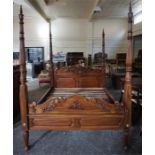 A Good Quality Reproduction Hardwood Four Poster Bed, with side rails and wooden slats, 222cm