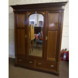 A Victorian Style Mahogany Inlaid Wardrobe, with a moulded cornice above a glazed pivot door,