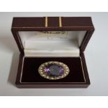 A 9ct Gold Amethyst & Seed Pearl Ring, the large Amethyst measuring approximately 2cm diameter,