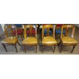 A Set Of Four Late Victorian Gothic Style Oak Dining Chairs, with later tan hide upholstered stuff-