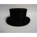 A Silk Top Hat By Bennetts Of London, the inner width of hat is 15.5cm wide, in a fitted box with